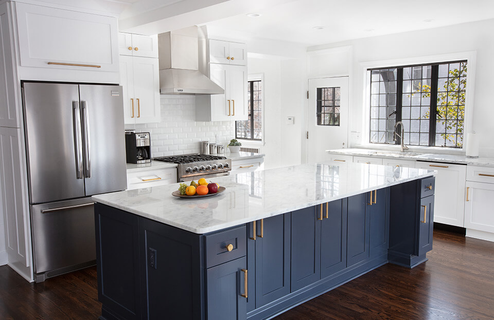 a beautiful kitchen remodeling project in Toledo. Featuring a blue island and white cabinets