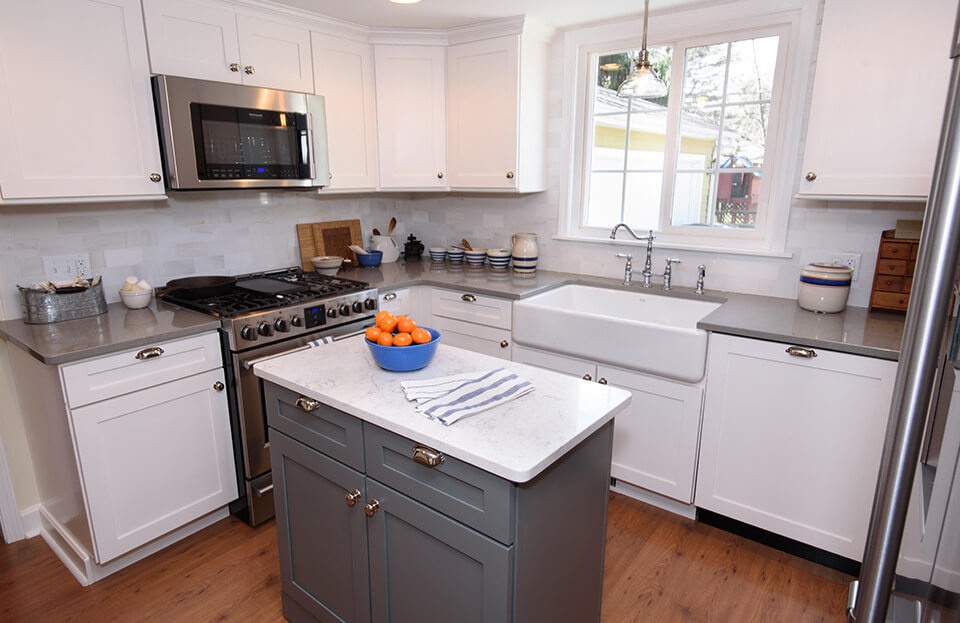 kitchen remodel in toledo ohio. a small gray island is in the center