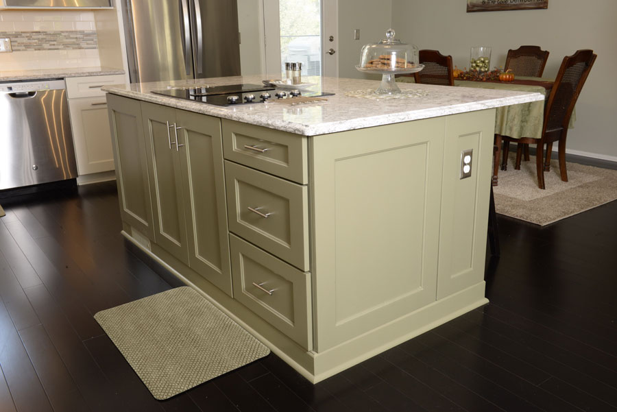 Sage green island in a updated kitchen remodel