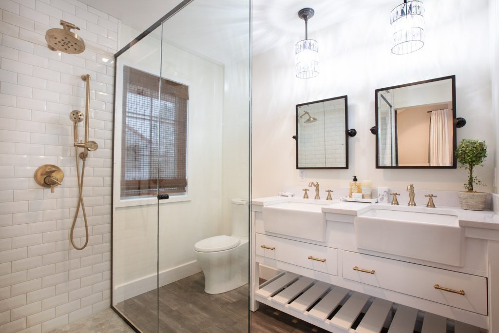 Newly remodeled bathroom in Toledo with two sinks and large walk-in shower.