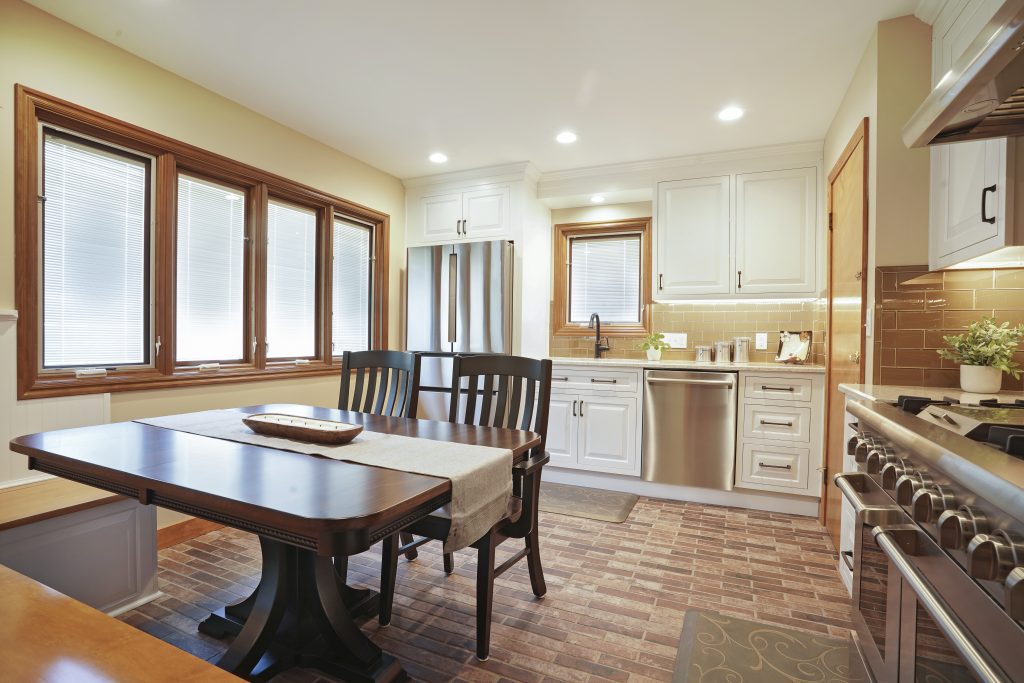 Remodeled kitchen with built in bench seating around table.