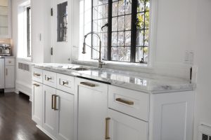 Newly remodeled kitchen with large window over sink.