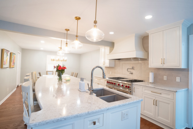 Large kitchen newly renovated with large island and great lighting.