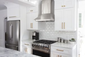 Modern renovated kitchen stove and backsplash.