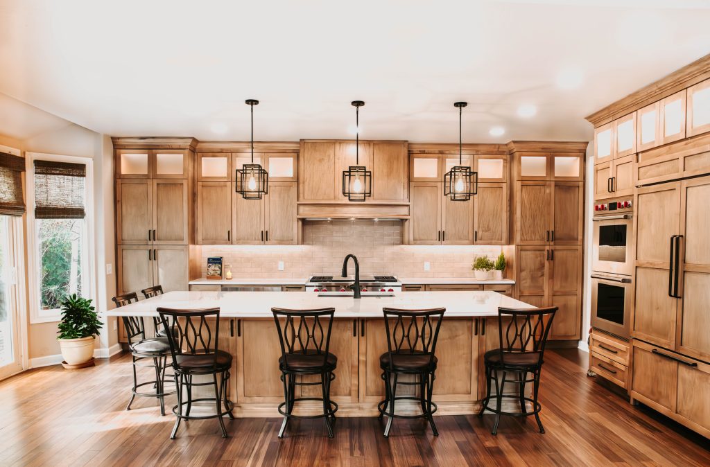 Newly updated, renovated kitchen with large island and wood cabinets.