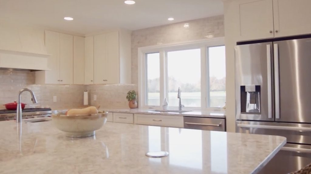 Recently remodeled kitchen with large island and windows. 