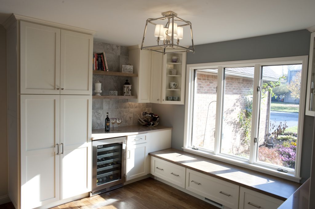 Remodeled entryway with built in storage and seating.